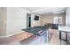 Spacious game room with ping pong table, a wall-mounted TV, and comfortable sofa, perfect for entertainment at 17855 Lake Side Dr, Monument, CO 80132