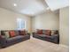 Spacious living room with two sofas, recessed lighting, and neutral carpeting for a comfortable and inviting atmosphere at 17855 Lake Side Dr, Monument, CO 80132