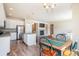An open concept floorplan connects the kitchen with island, dining area, and living room with fireplace at 17855 Lake Side Dr, Monument, CO 80132