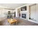 This open floorplan features a fireplace and flows from the living room into the kitchen with breakfast bar at 17855 Lake Side Dr, Monument, CO 80132