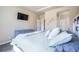 Bedroom features a cozy queen bed, light gray dresser, and decor to highlight the relaxing space at 17855 Lake Side Dr, Monument, CO 80132