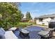 Inviting backyard featuring a deck with outdoor seating and a hammock for relaxation at 720 Independence Dr, Longmont, CO 80504