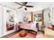 Charming bedroom with a cozy bed, playful decor, and a full-length mirror at 720 Independence Dr, Longmont, CO 80504