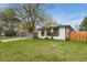 Attractive home showcasing a well-kept lawn, mature trees, and inviting curb appeal at 720 Independence Dr, Longmont, CO 80504