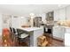 Well-appointed kitchen featuring a center island with barstool seating and stainless steel appliances at 720 Independence Dr, Longmont, CO 80504