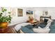 Cozy living room with stylish furnishings, a decorative rug, and a television at 720 Independence Dr, Longmont, CO 80504