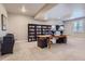 Spacious basement area with carpet, shelving, and room for an office at 6805 Zebra Grass Ln, Parker, CO 80138