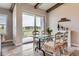 Bright dining area with stylish furniture and a large sliding glass door leading to a deck at 6805 Zebra Grass Ln, Parker, CO 80138