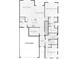 Detailed first-floor floor plan showcasing an open-concept design with a kitchen, dining area, and bedrooms at 6805 Zebra Grass Ln, Parker, CO 80138