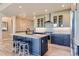 Modern kitchen featuring a center island, stainless steel appliances, and pendant lighting at 6805 Zebra Grass Ln, Parker, CO 80138