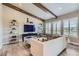 Comfortable living room featuring vaulted ceilings, wood beams, large windows, and stylish decor at 6805 Zebra Grass Ln, Parker, CO 80138
