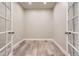 Office space with wood floors, neutral walls, and glass French doors offering a quiet retreat at 6805 Zebra Grass Ln, Parker, CO 80138