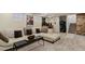 Basement living room with carpet floors, stone stairs, and a white couch at 916 Adams St, Denver, CO 80206