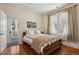 Cozy bedroom with hardwood floors, large windows, and stylish decor at 916 Adams St, Denver, CO 80206