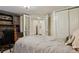 Bedroom features a desk, double closet, and a partial view to another bedroom at 916 Adams St, Denver, CO 80206