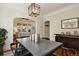 Stylish dining room with hardwood floors, an archway, and ample space for entertaining guests at 916 Adams St, Denver, CO 80206