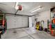 Spacious garage with an automatic door, bright lighting and ample storage racks at 916 Adams St, Denver, CO 80206