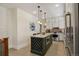 A full kitchen view showcasing the island and appliances at 916 Adams St, Denver, CO 80206