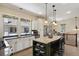 Bright kitchen featuring an island with seating and eat in dining nook with lots of natural light at 916 Adams St, Denver, CO 80206