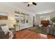 Bright living room with hardwood floors, a piano, and large windows offering plenty of natural light at 916 Adams St, Denver, CO 80206