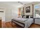 Well-lit bedroom featuring hardwood floors and two large windows at 916 Adams St, Denver, CO 80206