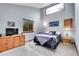 Relaxing bedroom with high ceilings, two large windows, a dresser and neutral tones at 2654 Sinton Rd, Evergreen, CO 80439