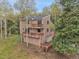 Multi-level home with large decks and a garage, surrounded by aspen and evergreen trees at 2654 Sinton Rd, Evergreen, CO 80439