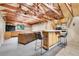 Cozy finished basement featuring bar area, comfortable seating, and ample natural light at 2654 Sinton Rd, Evergreen, CO 80439