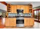 Well-equipped kitchen with wood cabinets, stainless steel appliances, and granite countertops at 2654 Sinton Rd, Evergreen, CO 80439