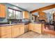 Kitchen with stainless steel appliances, wood cabinets, and granite countertops adjacent to dining room at 2654 Sinton Rd, Evergreen, CO 80439