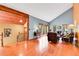 Spacious living room with wood floors, high ceilings, a staircase, and views of the outdoors at 2654 Sinton Rd, Evergreen, CO 80439