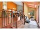 Cozy living area featuring a stylish staircase with wooden rails and a comfortable seating area near a bright window at 2654 Sinton Rd, Evergreen, CO 80439