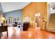 Comfortable living room with wood floors, vaulted ceiling, and large windows at 2654 Sinton Rd, Evergreen, CO 80439