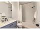 Simple bathroom with a bathtub, shower, and modern vanity at 579 Backcountry Ln, Highlands Ranch, CO 80126