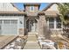 Inviting home exterior with stone accents and landscaping at 579 Backcountry Ln, Highlands Ranch, CO 80126