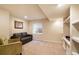 Finished basement sitting area featuring built-in shelving at 12444 Knox Ct, Broomfield, CO 80020