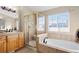 Bathroom featuring a shower and garden tub at 12444 Knox Ct, Broomfield, CO 80020