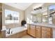 Elegant bathroom with soaking tub and double vanity at 12444 Knox Ct, Broomfield, CO 80020