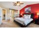 Spacious bedroom with a king-size bed and an accent wall at 12444 Knox Ct, Broomfield, CO 80020