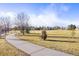 Paved path meanders through a grassy neighborhood park at 12444 Knox Ct, Broomfield, CO 80020