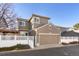 Two-story home with attached garage and landscaped yard at 12444 Knox Ct, Broomfield, CO 80020