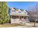 Two-story home with brick facade and front porch at 12444 Knox Ct, Broomfield, CO 80020