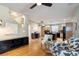 Open concept Gathering room with hardwood floors and views into the kitchen at 12444 Knox Ct, Broomfield, CO 80020