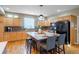 Bright kitchen with center island, stainless steel appliances, and hardwood floors at 12444 Knox Ct, Broomfield, CO 80020