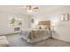 Stylish bedroom with modern decor, accent rug and ample natural light at 13606 E Bates Ave # 309, Aurora, CO 80014