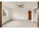 Spacious bedroom with a ceiling fan and natural light from a window at 13606 E Bates Ave # 309, Aurora, CO 80014