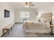 Well-lit bedroom with a large window, ceiling fan and modern decor at 13606 E Bates Ave # 309, Aurora, CO 80014