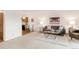 Comfortable living room featuring a plush sofa, coffee table, and neutral decor at 13606 E Bates Ave # 309, Aurora, CO 80014