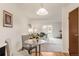 A living room with carpet, a dining table, and a sliding glass door at 13606 E Bates Ave # 309, Aurora, CO 80014