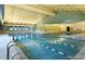 Indoor pool area with natural light, marked lanes, and overhead ventilation system at 13606 E Bates Ave # 309, Aurora, CO 80014